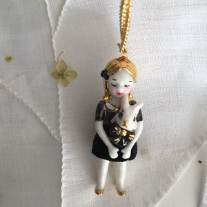 Alice in Wonderland necklace, Alice in black porcelain doll long necklace  with beautiful details and her rabbit is the perfect gift