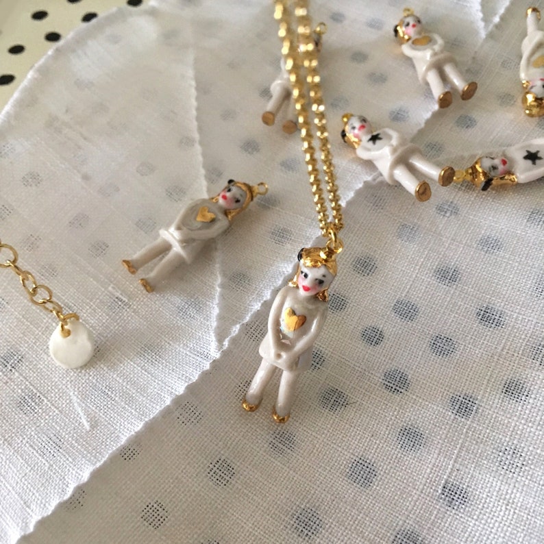 Cute and tiny porcelain doll necklace with a gold heart and a vermeil chain image 1