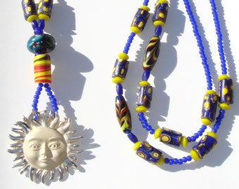 Long African Trade Bead Necklace with Blue Vintage White Heart African Trade beads and a Taxco Sterling Sun Pendant