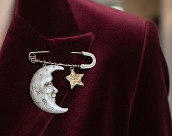 Broche con declaración de luna y estrella inspirado en el arte popular