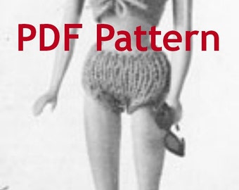 May include: A black and white photograph of a doll wearing a knitted bikini top and bottom. The doll has long hair and is holding a small purse. The text "PDF Pattern" is printed on the image.