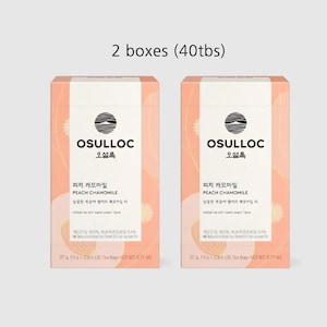 May include: Two boxes of OSULLOC Peach Chamomile tea. Each box is peach and white with text in multiple languages. The boxes have a circular logo and the text "PEACH CHAMOMILE". Each box contains 20 tea bags, with a net weight of 0.71 oz.