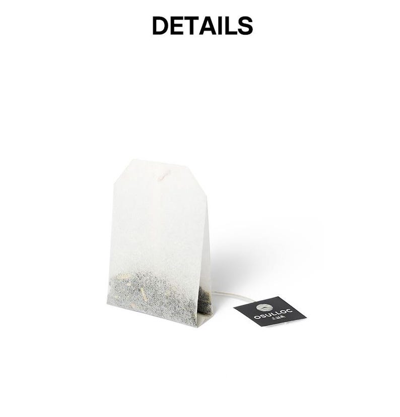 May include: A white tea bag with a string and a small black tag. The tea bag is filled with loose tea leaves. The tag reads "OSULLOC" in white text. The word "DETAILS" is at the top of the image.