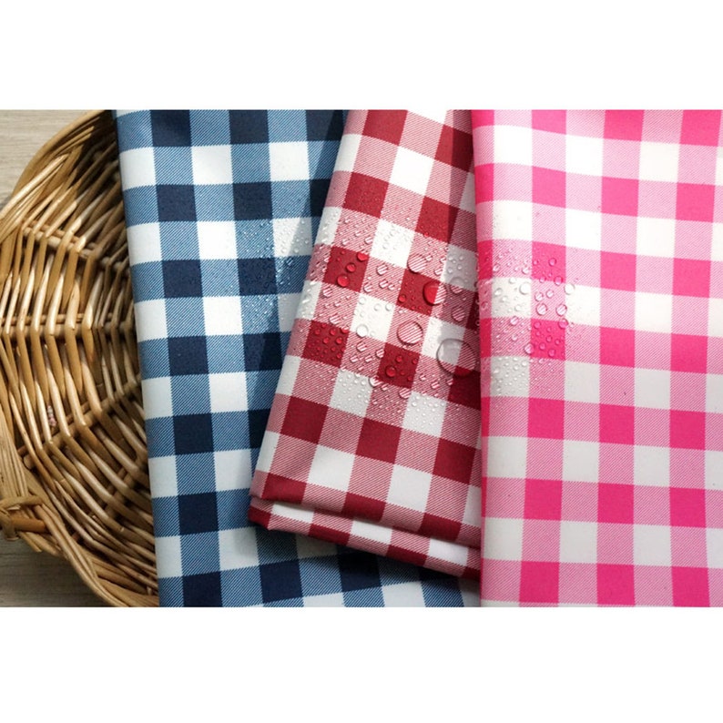 May include: Three gingham fabric swatches in blue, red, and pink. The fabric is waterproof and has a checkered pattern.