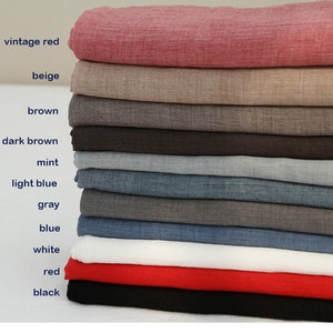 May include: Stack of fabric swatches in various colors, including vintage red, beige, brown, dark brown, mint, light blue, gray, blue, white, red, and black.