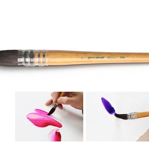 May include: A watercolor brush with a wooden handle and a dark, pointed tip. The brush is shown in detail, along with two smaller images demonstrating its use in painting pink and purple strokes on white paper. The brush has silver metal rings.