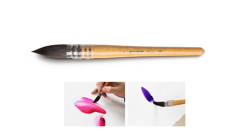 May include: A watercolor brush with a wooden handle and a dark, pointed tip. The brush is shown in detail, along with two smaller images demonstrating its use in painting pink and purple strokes on white paper. The brush has silver metal rings.