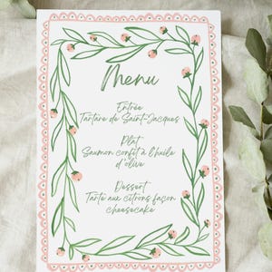 Menú y tarjetas de lugar en tonos verde espino y rosa.