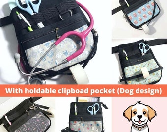 May include: Black medical waist pack with multiple pockets, a dog-themed patterned front pocket, and a pink stethoscope. The pack contains scissors, pens, and a notepad. The text "With holdable clipboard pocket (Dog design)" is visible.