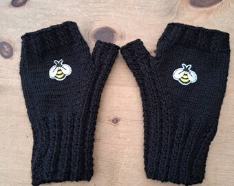 Hand knitted appliqued handwarmers featuring little bee motif