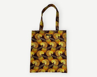 Yellow Swirls shimmering print tote bag in bold patterned thick cotton