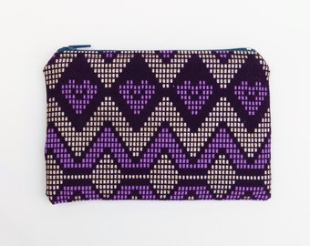 Handmade coin purse in Aztec patterned fabric in purple and gold glitter print