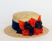 Dunfermline - Canotier de paja con detalle de flores y hojas de seda y terciopelo en azul y naranja