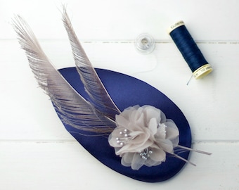 Caerlaverock - Silk Blue Fascinator with detail of organza flowers and peacock feathers