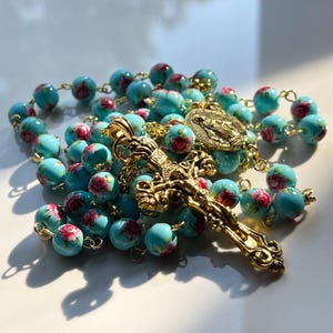 Handmade blue with red flower patterned rosary