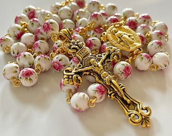 Handmade white with pink flower patterned rosary