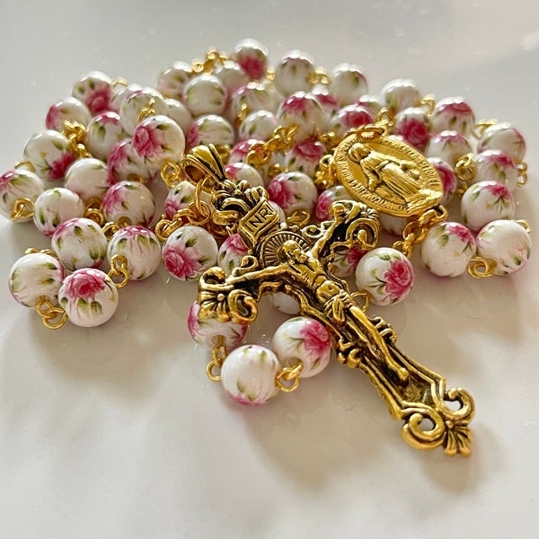 Handmade white with pink flower patterned rosary