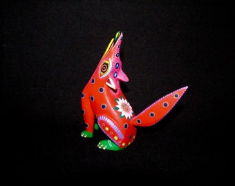 Red Coyote With Pink Sunflower by Maria y Jacobo Angeles