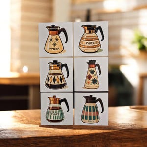 May include: Six square cards featuring illustrations of Pyrex coffee pots in various designs. Each pot has a black handle and a lid, with different patterns and the word "PYREX" on the front. The backgrounds are white.
