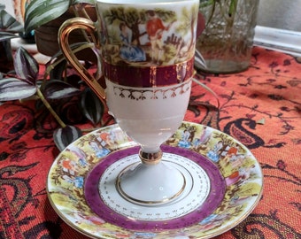 Taza de té Vintage Royal Vienna con taza y platillo de patas altas de pareja de cortejo. Modelo # 33/45