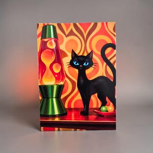 May include: A retro-style print featuring a black cat with blue eyes, a lava lamp, and a red and orange patterned background. The lava lamp is green and has orange wax inside. A small dish holds green and orange spheres.
