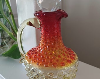 Vintage Amberina hobnail glass cruet with glass stopper.