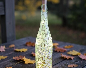 Hand painted Talavera wine bottle with fairy lights included .