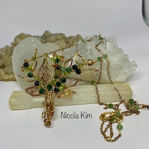spring necklace of strawberry green quartz and emerald in gold plated wire