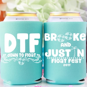May include: Two turquoise blue can coolers with white text. The left cooler says "DTF down to float" with a life preserver and waves. The right cooler says "Brooke and Justin Float Fest 2017" with a palm tree and life preserver.