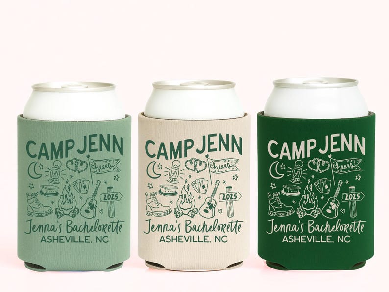 May include: Three foam can coolers in sage green, beige, and forest green. Each features the text CAMP JENN, Jenna's Bachelorette, and ASHEVILLE, NC, with illustrations of a lantern, campfire, guitar, hiking boot, and a flag labeled cheers 2025.