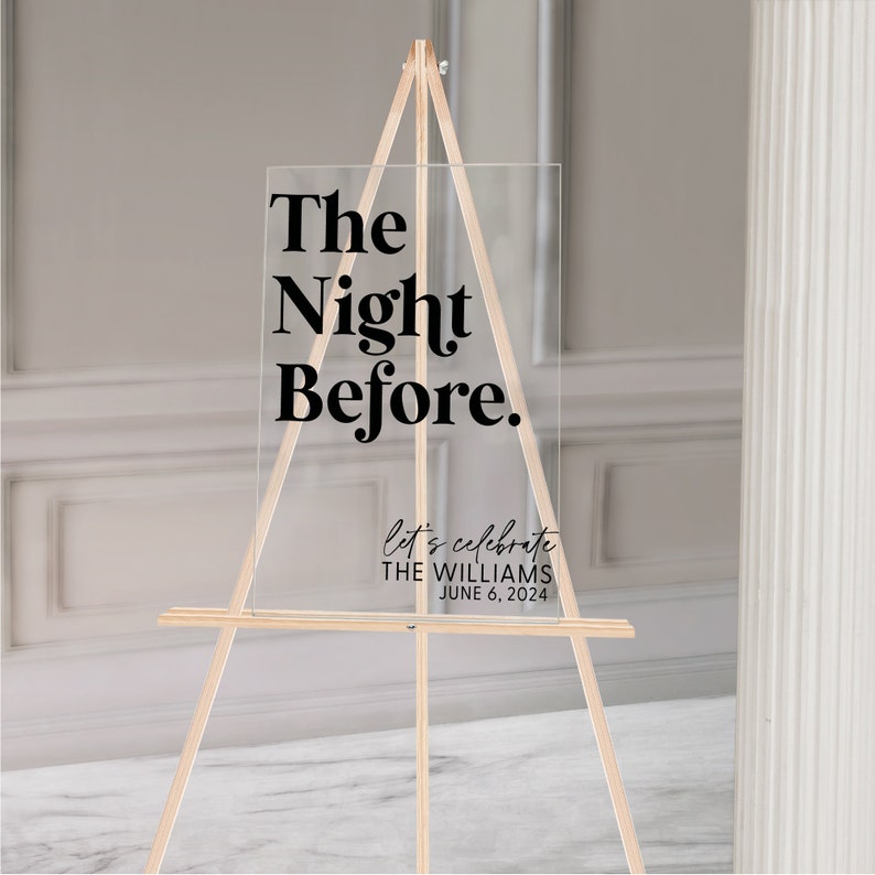 clear acrylic wedding sign with black text the night before