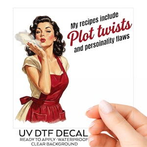 May include: A UV DTF decal featuring a retro-style illustration of a person with dark hair wearing a red apron, blowing a kiss. The text reads: My recipes include Plot twists and personality flaws. Below, the text reads: UV DTF DECAL READY TO APPLY WATERPROOF CLEAR BACKGROUND.
