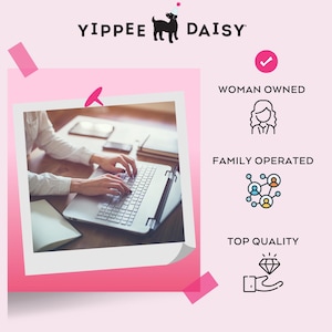 a woman is typing on a laptop computer