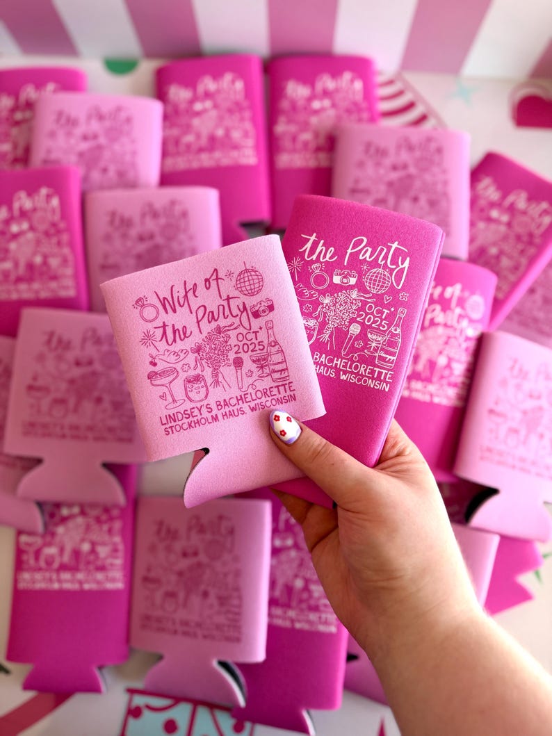 May include: Pink and fuchsia can coolers with white text and illustrations. One cooler reads "Wife of the Party" and the other reads "The Party". Both include the date "OCT 2025" and "Lindsey's Bachelorette".