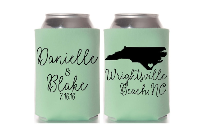 May include: Two mint green can coolers. One cooler has the names "Danielle & Blake" and the date "7.16.16" in black script. The other cooler has a black silhouette of North Carolina with a heart and the text "Wrightsville Beach, NC".