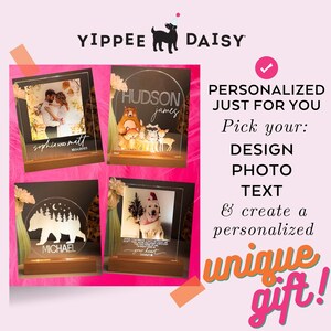 May include: Three examples of personalized acrylic light-up signs with different designs. The first sign features a couple's photo with their names and wedding date. The second sign features a woodland scene with a bear, fox, and raccoon, with the names "Hudson" and "James". The third sign features a bear and trees with the name "Michael".