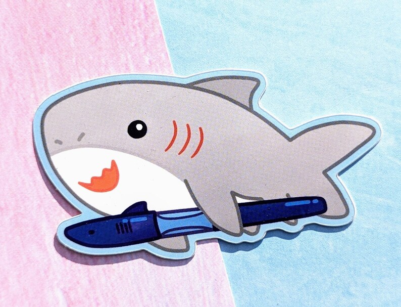 A cartoon shark holding a Jinhao shark fountain pen. The fountain pen has the head and fin of a shark and is made of blue plastic.