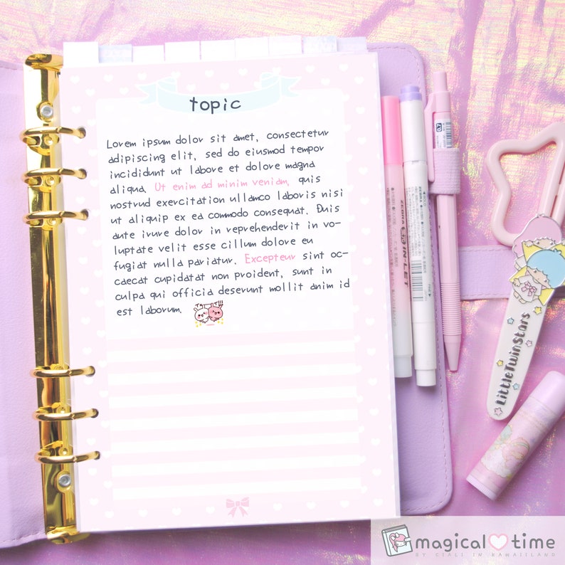 May include: A pink and white notebook with gold rings and a quote about work and life. The notebook is open to a page with the word "topic" written at the top. The notebook is surrounded by pink and white stationery items, including pens, a pencil, and a lip balm.