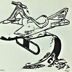 May include: Black and white line art print of a vintage metal toy airplane with the text "USAF" on the tail. The toy is on a wooden base and has a star on the side. The print is numbered 8/250.