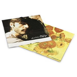 May include: Two microfiber cleaning cloths, one with a black and white photo of a man's face and the text "Hair Salon Oyagi", and the other with a yellow background and a painting of sunflowers.