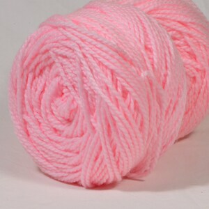 May include: A pink ball of yarn.