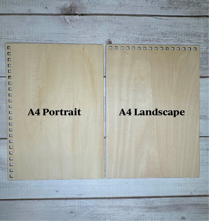 May include: Two pieces of unfinished wood, one labeled "A4 Portrait" and the other labeled "A4 Landscape".