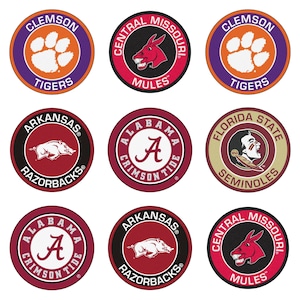 May include: Nine round, colorful, collegiate team logo decals. The logos include Clemson Tigers, Central Missouri Mules, Arkansas Razorbacks, Alabama Crimson Tide, Florida State Seminoles.
