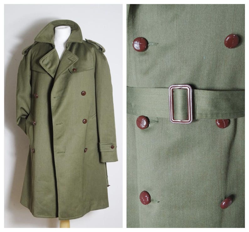 May include: A green double-breasted trench coat with a belt and brown buttons.