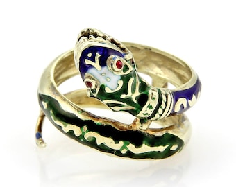May include: A gold ring with a coiled snake design. The snake is enameled in green, blue, and white with red eyes.
