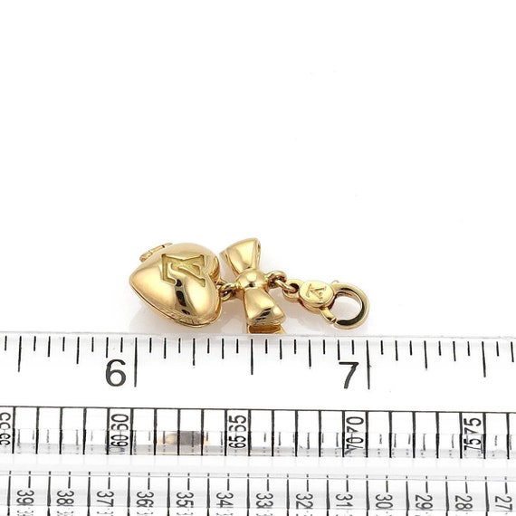 MAGNIFICENT LOUIS VUITTON 18K GOLD CHARM LUGGAGE BRACELET "7