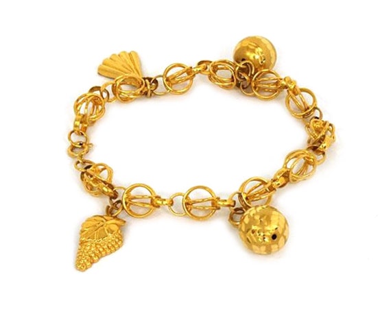 11540 - Dangling Charms Bracelet in 21k Gold - image 1