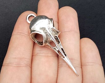 2 charms with crow skull. SP86-FO188