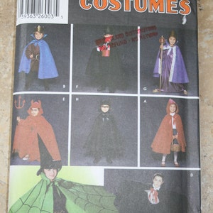 May include: Simplicity Costumes pattern packet featuring various Halloween costume designs. The packet includes images of children dressed as a king, devil, witch, and other characters. The packet has the number 5927.