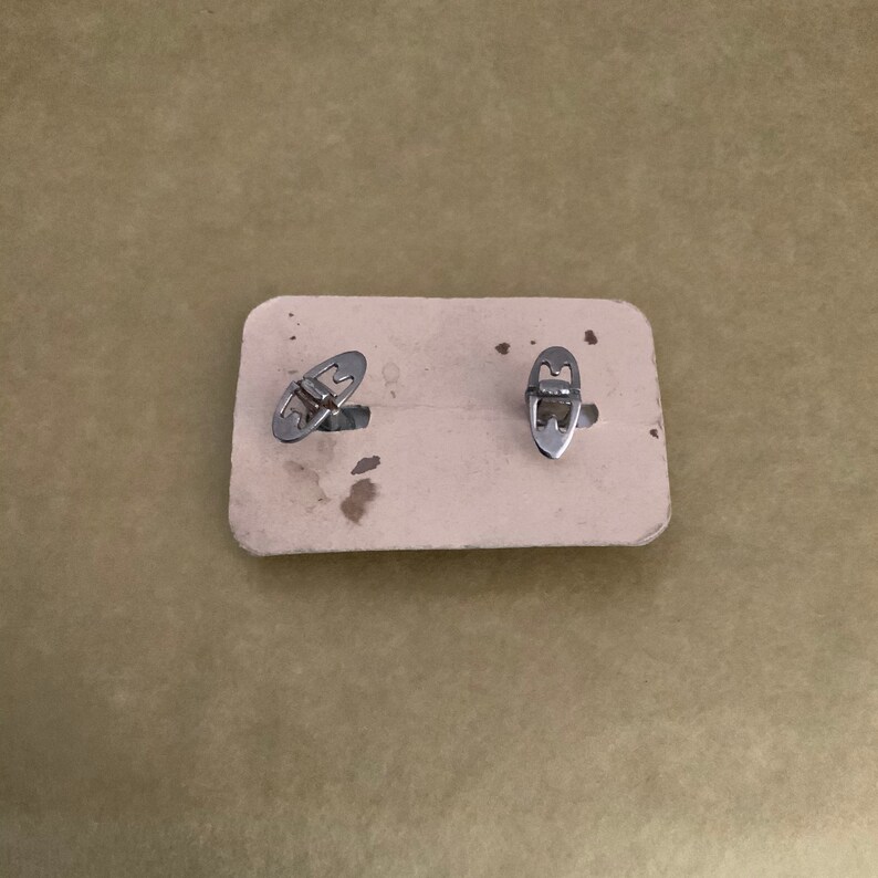 1950\u2019s mother of pearl cufflinks.